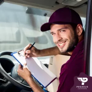Image of a courier driver in a van getting ready to delivery