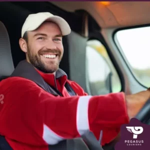 Image of a happy courier driver for Pegasus couriers. Working as a courier driver is more than just a job - it's a lifestyle choice. If you enjoy being on the open road, seeing different sights daily, and having control over your work schedule, this might be the right fit for you.